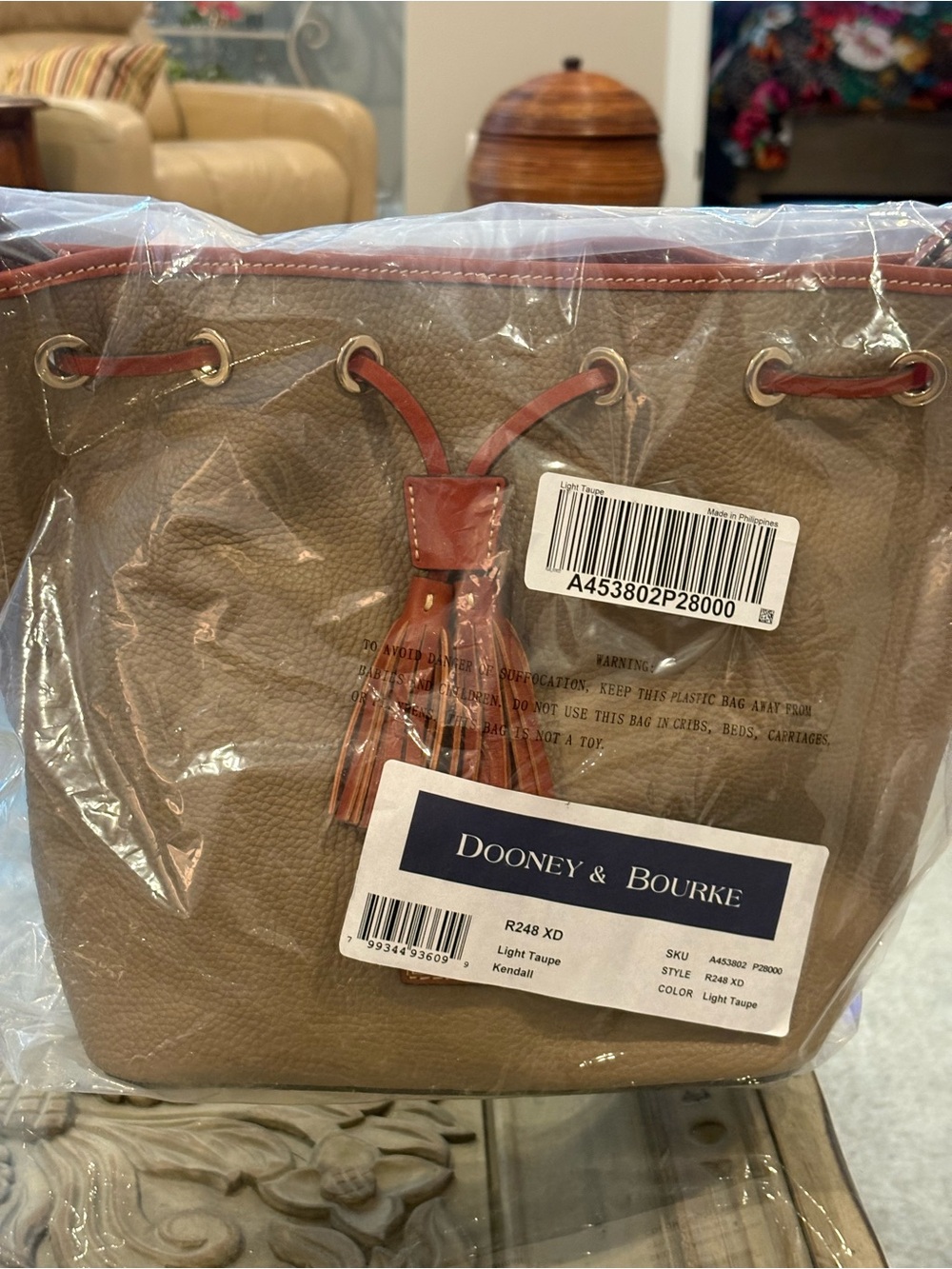 Dooney & Bourke Light Taupe Pebble Leather Drawstring Tote with Brown Trim